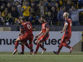 Sebastian Giovinco of Toronto celebrates with teammates after scoring his team's second goal during the quarterfinals second leg match between Tigres UANL and Toronto FC as part of the CONCACAF Champions League 2018 at Universitario Stadium on March 13, 2018 in Monterrey, Mexico.