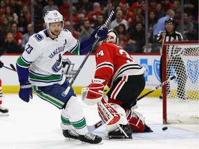 The Canucks, losers of seven straight heading into Chicago Thursday night, scored a lot of goals in the Windy City. Defenceman Alex Edler, who had a multi-goal game, scores on J-F Berube of the Blackhawks at the United Center in Chicago.