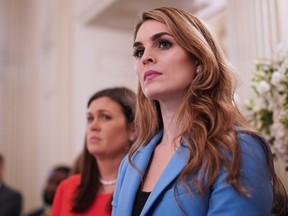 White House Communications Director Hope Hicks watches as US President Donald Trump takes part in a listening session on gun violence with teachers and students in the State Dining Room of the White House.