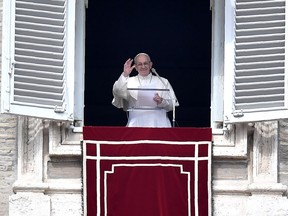 Pope Francis addresses the crowd from the window of the apostolic palace overlooking St Peter's square during the Sunday Angelus prayer, on March 4, 2018 in Vatican City.