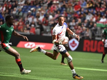 USA's Perry Baker (C) scores a try at the HSBC Canada Men's Sevens in BC Place Stadium in Vancouver, B.C.Canada, March 11, 2018. Vancouver is the 6th round, played March 10-11, 2018, in the HSBC Men's Sevens 10 round world series.