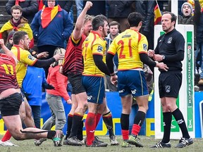 Spain's players confront against the referee during the rugby union match between the Belgian national rugby team and Spain at the European International Championship match in Brussels on Sunday.
