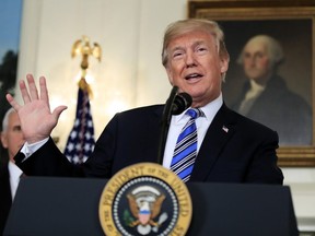 In this March 23, 2018, photo, Donald Trump speaks in the Diplomatic Room of the White House in Washington.