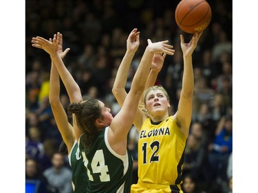 LANGLEY. March 03 2018..   Kelowna Owls #12 Kennedy Dickie shoots around and the Walnut Grove Gators #14 Natalie Rathler in the final of the AAA Girls High School Basketball final at LEC, Langley, March 03 2018.   Gerry Kahrmann  /  PNG staff photo)( For Prov / Sun News )   00052469A Story by Steve Ewen [PNG Merlin Archive]