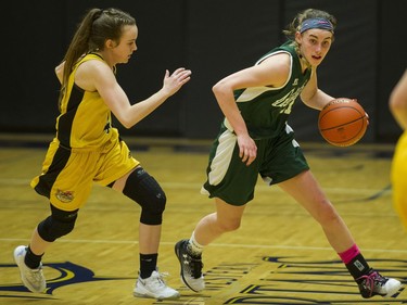 LANGLEY. March 03 2018..  Walnut Grove Gators #11 Tavia Rowell moves past Kelowna Owls #4 Kasey Patchell in the final of the AAA Girls High School Basketball final at LEC, Langley, March 03 2018.   Gerry Kahrmann  /  PNG staff photo)( For Prov / Sun News )   00052469A Story by Steve Ewen [PNG Merlin Archive]