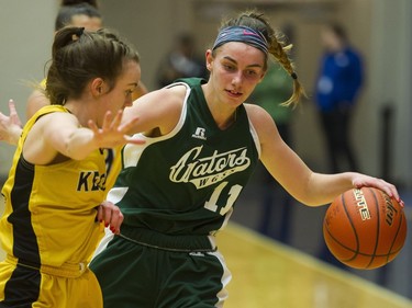 LANGLEY. March 03 2018..   Kelowna Owls #4 Kasey Patchell defends against Walnut Grove Gators #11 Tavia Rowell in the final of the AAA Girls High School Basketball final at LEC, Langley, March 03 2018.   Gerry Kahrmann  /  PNG staff photo)( For Prov / Sun News )   00052469A Story by Steve Ewen [PNG Merlin Archive]