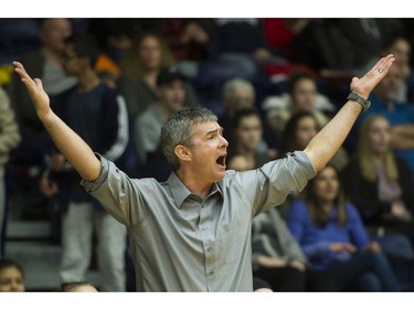 LANGLEY. March 03 2018..   Kelowna Owls head coach Darren Semeniuk gesture to the referees during play against the Walnut Grove Gators in the final of the AAA Girls High School Basketball final at LEC, Langley, March 03 2018.   Gerry Kahrmann  /  PNG staff photo)( For Prov / Sun News )   00052469A Story by Steve Ewen [PNG Merlin Archive]