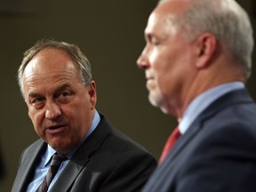 Green party Leader Andrew Weaver, left, has threatened Premier John Horgan's government over its recent announcement regarding a new LNG pipeline and plant in Kitimat.