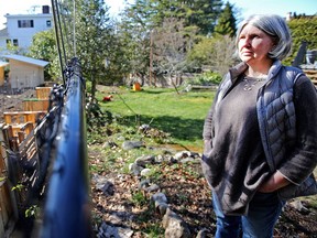 VICTORIA, B.C.: March, 15, 2018 - Portrait of Chantal Meagher in her backyard at 1347 Craigdarroch Rd, She is very concerned about the 100 chickens and chicken coops being built on the neighbouring property. VICTORIA, B.C. March 15, 2018. (ADRIAN LAM, TIMES COLONIST). For City story by Katie DeRosa. [PNG Merlin Archive]