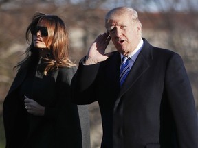 President Donald Trump gestures as he walks across the South Lawn of the White House in Washington with first lady Melania Trump, Saturday, March 3, 2018, as they return from Trump's Mar-a-Lago estate in Palm Beach, Fla.