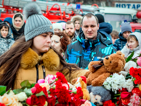 A teddy bear lies on top of a memorial to the victims of a fire at the shopping centre in Kemerovo, Russia on March 26, 2018.