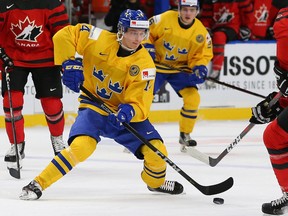 Elias Pettersson of Sweden takes on Canada during the Gold medal game of the IIHF World Junior Championship at KeyBank Center in Buffalo, N.Y., in January. Canada beat Sweden 3-1. Petterson was among the leading scorers of the tournament and looks to juice up the Canucks' offence when he joins the team next year.