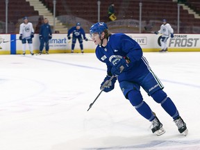 Adam Gaudette of the Vancouver Canucks skates up ice during the Canucks game-day skate before the NHL game against the Anaheim Ducks at Rogers Arena March 27, 2018 in Vancouver, British Columbia, Canada.