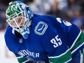 Vancouver Canucks' goalie Thatcher Demko waits for a faceoff during the first period of an NHL hockey game against the Columbus Blue Jackets in Vancouver, B.C., on Saturday March 31, 2018.