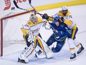 Nashville Predators' defenceman P.K. Subban worked over Brock Boeser of the Vancouver Canucks when the NHL teams tangled on Dec. 13, 2017 at Rogers Arena.