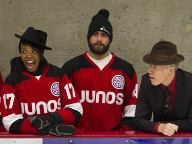 Team Rockers coaches Kellylee Evans (left), Connor Stephen (centre) and Craig Northey on the bench as their team plays Team NHL and Olympians in the 15th annual Juno Cup hockey game at the Bill Copeland Sports Centre in Burnaby Friday.