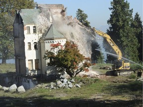 Workers demolish the last section of Woodlands in New Westminster in 2011.. The infamous institution dated from the late 19th century and was in use until 1996.