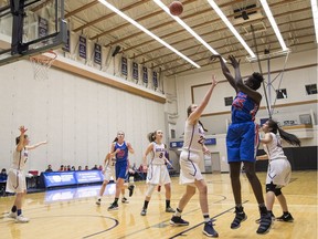 Faith Dut of the Semiahmoo Totems fires a baseline shot Thursday against the Brookswood Bobcats of Langley in the triple-A girls' provincial basketball championship tournament being played at Langley Events Centre.