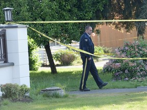 Police investigate the scene Redelma Belissario's death in the 1000 block Woodhead Road in Richmond in May 2015.