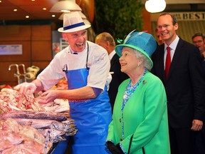 Her Majesty Queen Elizabeth II meeting Fish Monger Pat O'Connell at  The English Market in Cork City on their State Visit to Ireland.