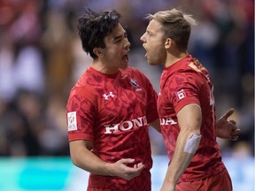 Canada's Nathan Hirayama, left, and Harry Jones celebrate Jones' try against New Zealand during World Rugby Sevens Series action, in Vancouver, B.C., on Saturday, March 11, 2017.