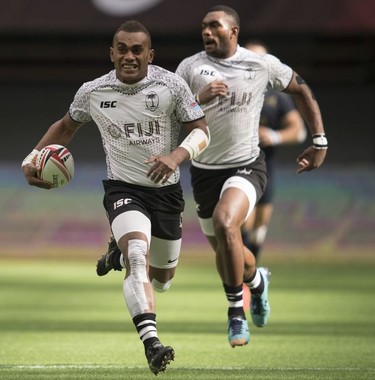 Eroni Sau of Fiji runs to score a try during a match against Argentina at the World Rugby Seven Series at B.C. Place in Vancouver, Sunday, March, 11, 2018.