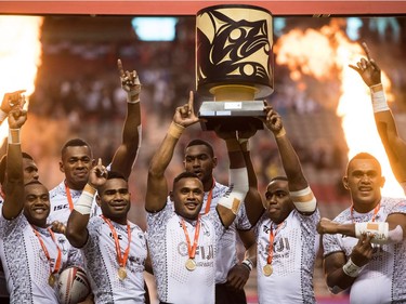 Fiji players celebrate with the trophy after defeating Kenya to win the World Rugby Sevens Series final, in Vancouver, B.C., on Sunday March 11, 2018.
