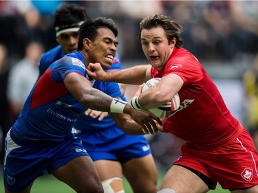 Canada's Pat Kay, right, is tackled by Samoa's Murphy Paulo during World Rugby Sevens Series action, in Vancouver, B.C., on Sunday March 11, 2018.