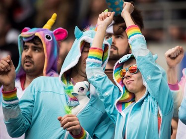 Spectators in costumes dance as Canada and Samoa play during World Rugby Sevens Series action, in Vancouver, B.C., on Sunday March 11, 2018.