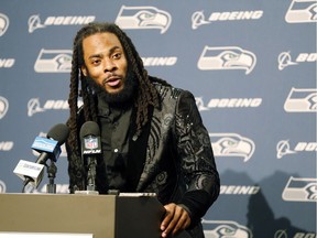In this Oct. 29, 2017, file photo, Seattle Seahawks cornerback Richard Sherman talks to reporters during a post-game press conference. The Seahawks are cutting ties with star cornerback Richard Sherman after seven seasons. The team has informed him that he will be released, and Sherman confirmed the decision.
