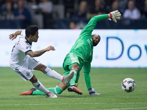 The Whitecaps will be hoping that Cristian Techera (left) can work his magic against the Galaxy, much like he did here last season against then-Galaxy goalkeeper Clement Diop. (Photo: Darryl Dyck, Canadian Press files)