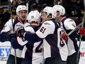 Windsor Spitfires' Thomas Stevenson, left, Daniel D'Amico (29), Luke Boka (61), Connor Corcoran (8) and William Sirman (12) celebrate Sirman's goal to open the scoring in Friday's 6-2 win over the Sarnia Sting in Game 1 in their OHL Western Conference quarter-final at Progressive Auto Sales Arena. (Mark Malone/Chatham Daily News/Postmedia Network)