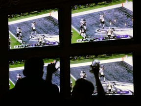 Fans at a Boston bar react to a Patriots touchdown against the Eagles during Super Bowl 52 in Minneapolis on Feb. 4, 2018.