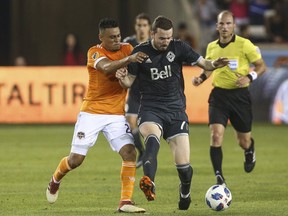 Vancouver Whitecaps midfielder Jordon Mutch (right) vies for the ball with Houston Dynamo defender Darwin Ceren during last Saturday’s 2-1 Whitecaps win in Houston, Texas. (Photo: Troy Taormina, USA Today Sports, via Vancouver Whitecaps)