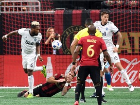 Mar 17, 2018; Atlanta, GA, USA; Vancouver Whitecaps defender Kendall Waston (4) elbows Atlanta United defender Leandro Gonzalez (5) during the first half at Mercedes-Benz Stadium. Vancouver Whitecaps defender Kendall Waston (4) was issued a red card and ejected from the game. Mandatory Credit: John David Mercer-USA TODAY Sports ORG XMIT: USATSI-379513 [PNG Merlin Archive]