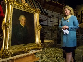 This portrait of Capt. George Vancouver is revealed in a ceremony with Janice Charette, Canadian high commissioner to the U.K., beside the replica of his ship HMS Discovery at the Royal B.C. Museum on Tuesday.