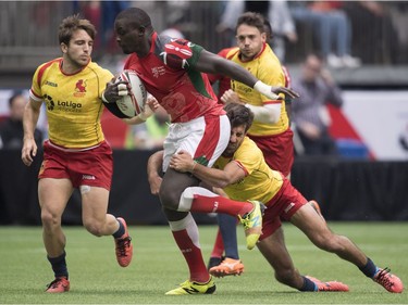 Andrew Amonde of Kenya is tackled by Pablo Fontes of Spain during the World Rugby Seven Series at B.C. Place in Vancouver, Saturday, March, 10, 2018.