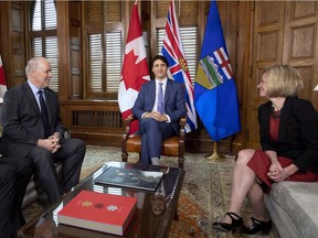 Premier Rachel Notley sits with Prime Minister Justin Trudeau and B.C. Premier John Horgan in Trudeau's office on Parliament Hill for a meeting on the deadlock over Kinder Morgan's Trans Mountain pipeline expansion, in Ottawa on Sunday.