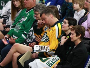 The family of Evan Thomas sits in the front tow of SaskTel Centre during his memorial service in Saskatoon, Sask., on April 16, 2018. Thomas was one of 16 people on the Humboldt Broncos team bus that died in a highway collision on April 6, 2018.