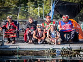 Protesters gather at the Marine Harvest fish farm on Swanson Island last year.