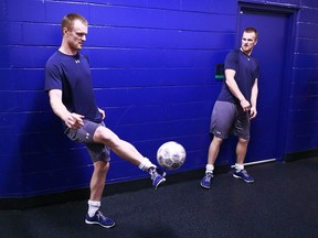 Henrik and Daniel Sedin play soccer before a game.