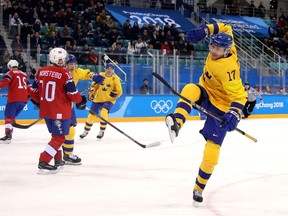 Par Lindholm celebrates scoring against Norway at the 2018 Winter Olympics in Pyeongchang, South Korea.