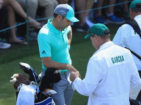 Sergio Garcia looks on dejectedly at the 16th tee after making a 13 on the 15th hole during the first round of the 2018 Masters Tournament at Augusta National Golf Club on Thursday.