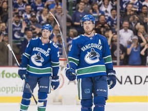 Daniel, right, and Henrik Sedin had fans on their feet Thursday night in Vancouver. Tonight they'll finish their NHL careers in Edmonton against the golf-ready Oilers.