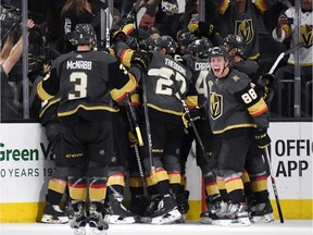 The Vegas Golden Knights celebrate after their 2-1 victory over the Los Angeles Kings in double overtime of Game 2 at T-Mobile Arena on April 13, 2018 in Las Vegas, Nevada.