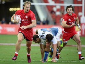 Harry Jones of Canada runs the ball during the 2018 Singapore Sevens Challenge Trophy Quarter Final match between Canada and France at National Stadium on April 29, 2018 in Singapore.