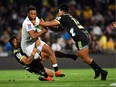 The Sharks (white) and the Hurricanes (black) do battle in Super Rugby action on April 6, 2018.