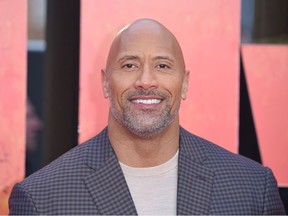 US actor Dwayne Johnson poses on the carpet arriving for the European premiere of the film Rampage in London on April 11, 2018.