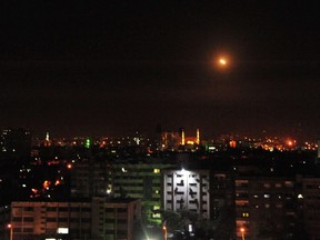 A photo released early on April 14, 2018 on the website of the official Syrian Arab News Agency (SANA) shows an explosion on the outskirts of Damascus after Western strikes reportedly hit Syrian military bases and chemical research centres in and around the capital. (HANDOUT/STR/AFP/Getty Images)