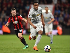 Manchester United striker Anthony Martial runs with the ball during an English Premier League football match between Bournemouth and Manchester United at Vitality Stadium in Bournemouth, southern England on April 18, 2018.